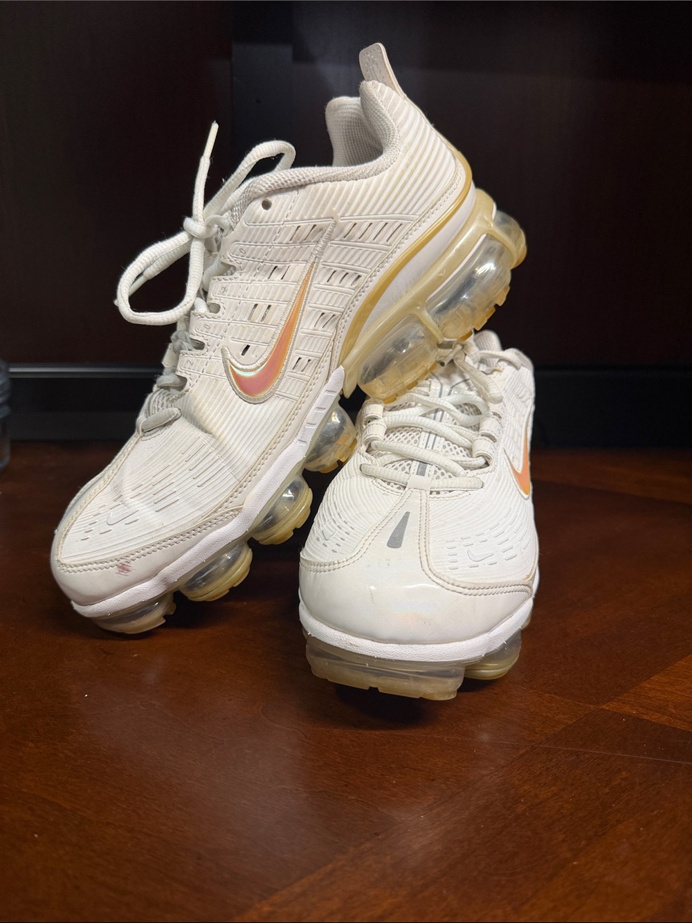 Nike Kids White Sneakers with Gold-Orange Swoosh